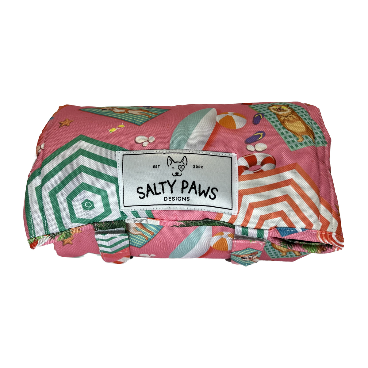 Folded colorful blanket with 'Salty Paws' label on a white background