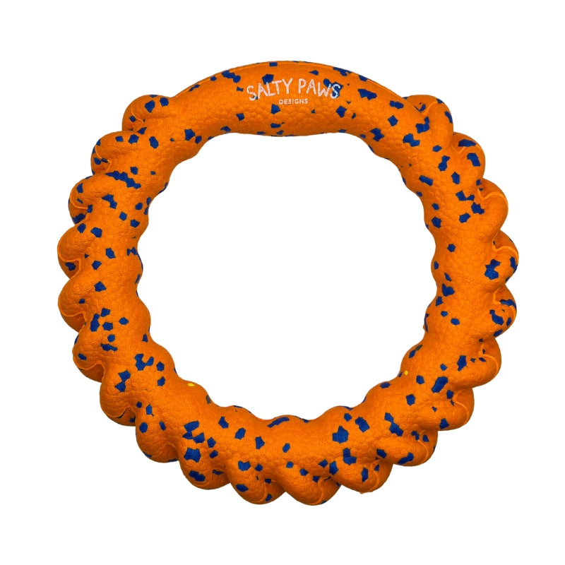 An orange textured ETPY toy dog ring with blue speckled accents and the 'SALTY PAWS DESIGNS' logo printed on the inside, shown on a solid white background.