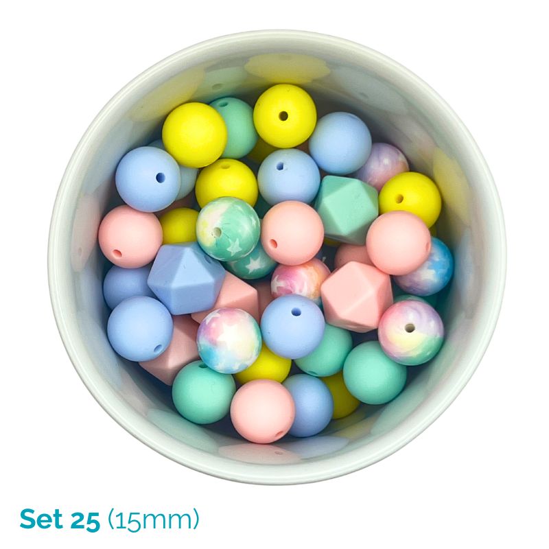 Assorted pastel-colored beads in a white container on a white background