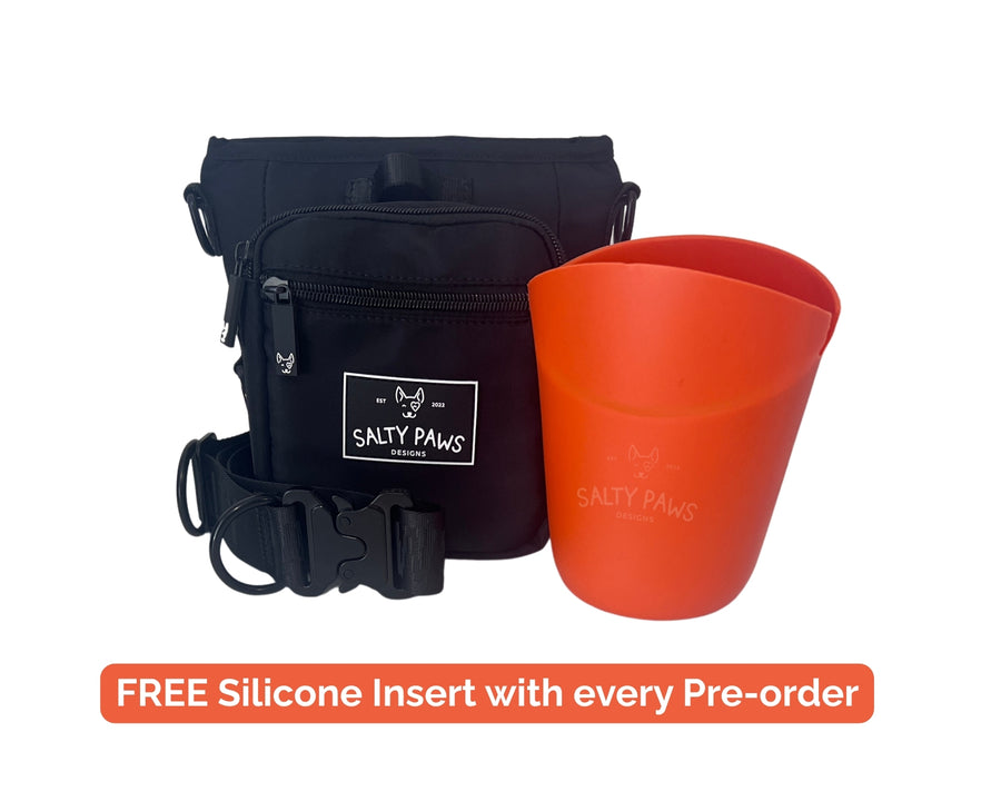 Black bag and orange silicone cup with 'Salty Paws' branding on a white background.