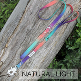 Salty Paws quick release dog lead in orange purple green gradient photographed in natural light showing aviation aluminium clip detail