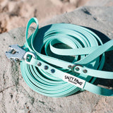 Salty Paws quick release waterproof long line lead in mint showing frog clip detail, coiled lead with D-ring hardware