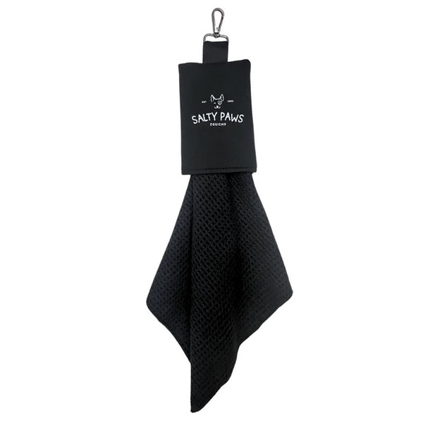 Salty Paws Slobber Towel in black hanging from a carabiner clip, waffle-knit fabric, compact dog towel