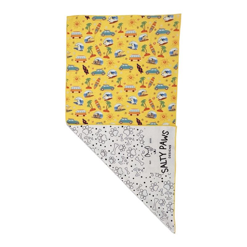 Salty Paws Surf's Up Adventure Dog Towel in yellow folded showing surf print front and white paw print reverse