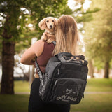 dog mum wearing Salty Paws Ultimate Adventure Grab Bag outdoors