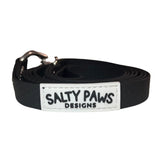 Salty Paws waterproof long line dog lead in black, coiled with silver hardware