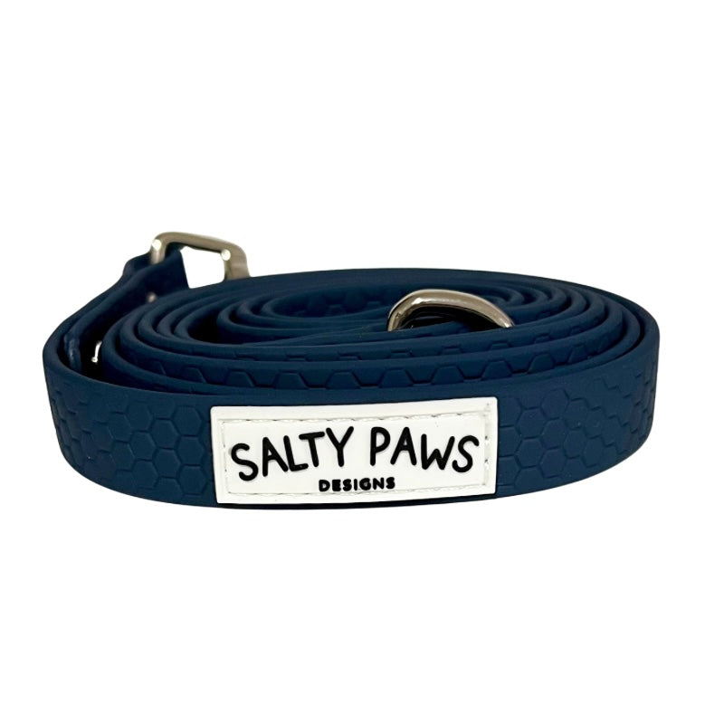 Salty Paws waterproof long line dog lead in kerosene navy, coiled with silver hardware