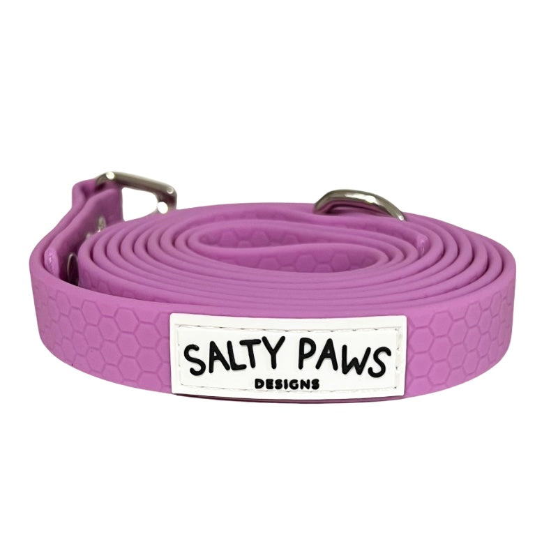 Salty Paws waterproof long line dog lead in lilac, coiled with silver hardware