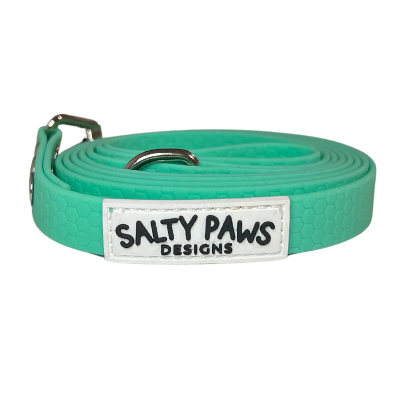 Salty Paws waterproof long line dog lead in seafoam green, coiled with silver hardware