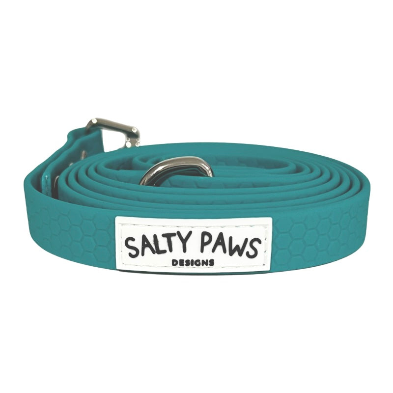 Salty Paws waterproof long line dog lead in teal, coiled with silver hardware