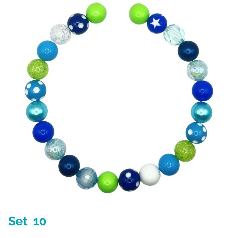 Colorful beaded necklace with blue, green, and white beads on a white background