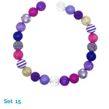 Colorful beaded dog necklace with various patterns on a white background