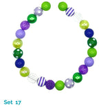 Colorful beaded dog necklace with various patterns on a white background