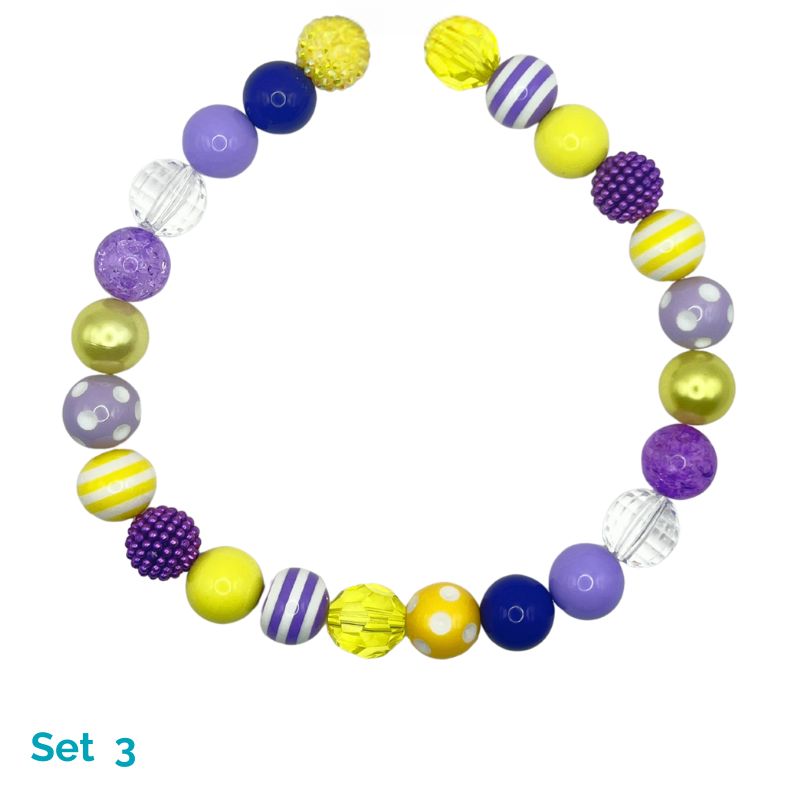 Colorful beaded dog necklace with various patterns on a white background