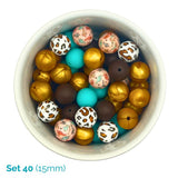 Assorted colorful beads in a white bowl on a white background