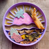 Sunset Slow Feeder in purple loaded with wet food and enrichment dog treats